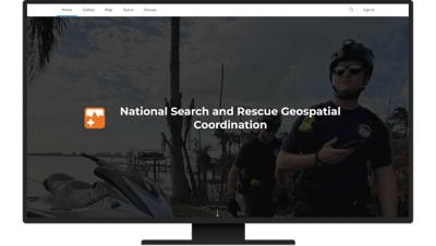 Search and rescue personnel with helmets and walkie talkies standing on a shoreline, overlaid with the title of National Search and Rescue Geospatial Coordination