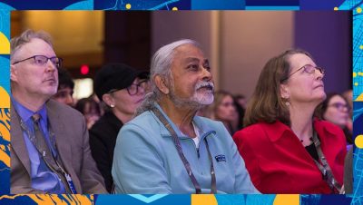 Audience listening attentively to a speaker during a presentation