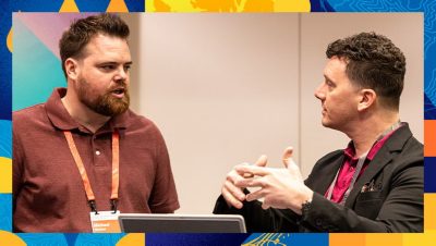 Esri expert explaining a concept to a conference attendee