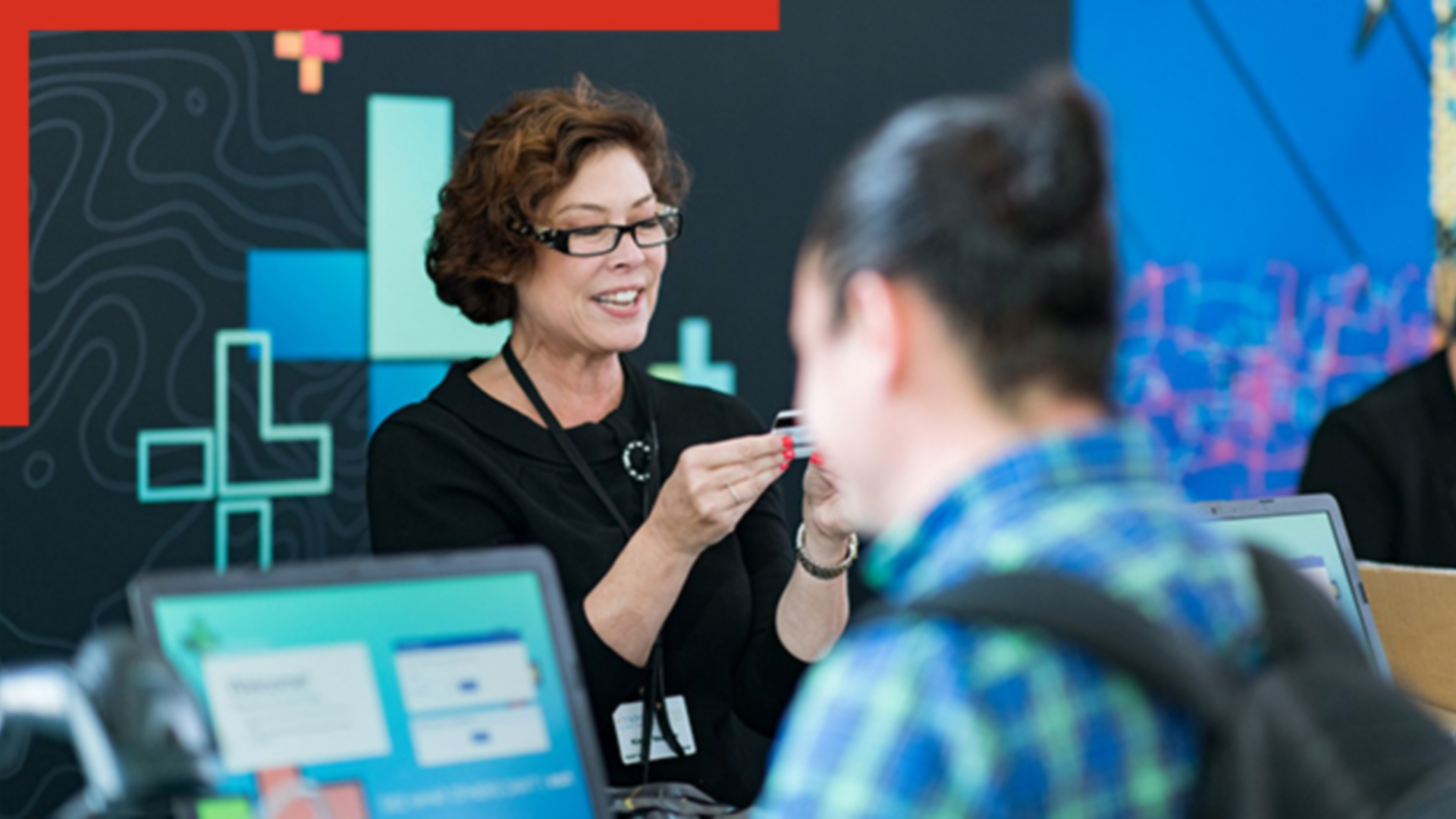 A professional setting featuring a registration desk at an event.