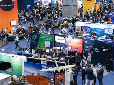 Esri FedGIS Expo as seen from above, with attendees walking through the area and interacting with exhibitors
