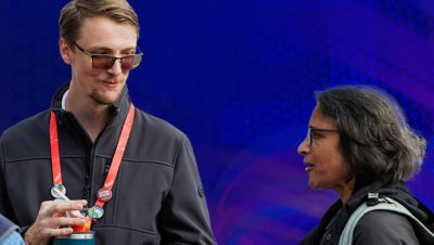 Two attendees talking to each other at the Esri Global Distributor Summit