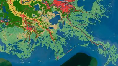 Carte du sud de la Louisiane avec des couleurs allant du vert au rouge indiquant les zones de changement d’occupation du sol détectées par l’intelligence artificielle géospatiale