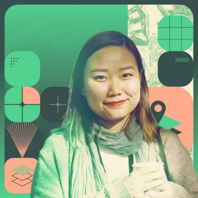 Stylized portrait of a smiling person wearing a scarf against a background of mapping graphics