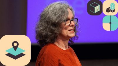 Presenter wearing a red blouse and glasses