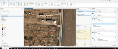  Aerial view of land parcels with blue boundary lines and numbers. Side panel displays data and workflow steps