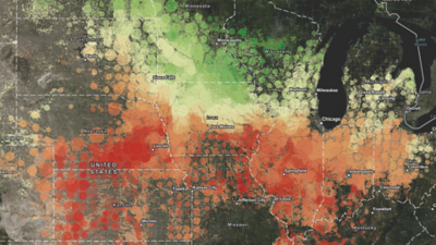An aerial image of livestock in a field shows an AI model identifying animals with some highlighted pink and others in blue
