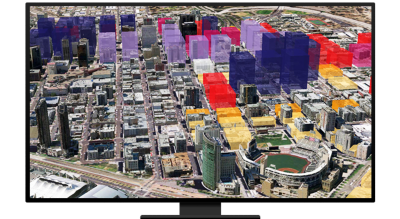 Graphic of a computer monitor displaying an aerial photo of an urban city with several buildings highlighted in purple, red, or yellow