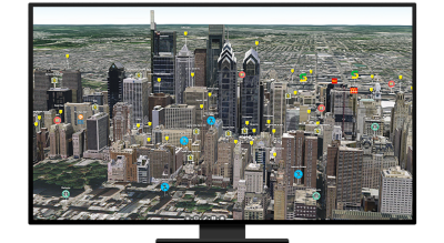 Graphic of a computer monitor displaying an aerial view of a city full of skyscrapers with distant suburbs in the background 