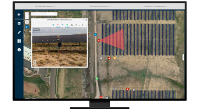 A desktop computer displaying a close-up of one part of a solar farm