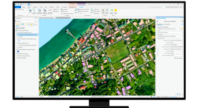 A graphic of a computer monitor displaying an aerial photo of a coastal neighborhood with menus on each side showing analysis options