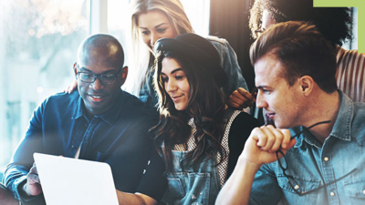 Five people looking at the same laptop screen