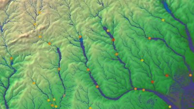 Topographic map with river networks and colored data points across a landscape