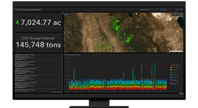 A graphic of a computer monitor displaying a map dashboard with data, a graph, and an aerial photo of a forest