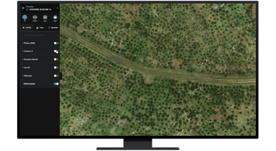 A graphic of a computer monitor displaying an aerial view of a green and brown forest with a road through the middle with an analysis legend on the side