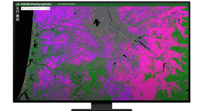 A graphic of a computer monitor displaying a heat map in bright green, pink, and purple