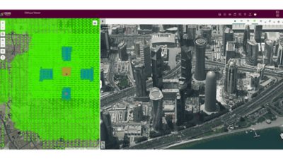 Aerial image of Qatar city filled with towering modern skyscrapers beside a map overlaid with a colorful grid