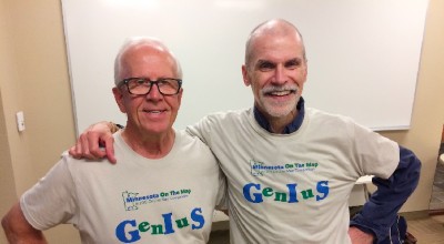 Retired educator standing next to Esri employee.
