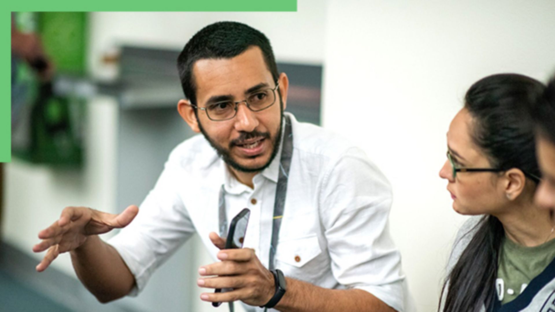 A group of individuals engaged in a discussion at a conference.