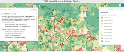 A map of an area with color patches indicates low-risk levels in green and high-risk levels in red