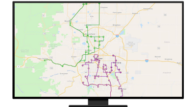 A graphic of a computer monitor displaying a state-level route map in green and purple
