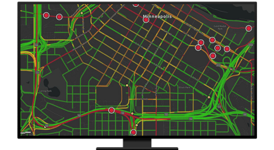 A graphic of a computer monitor displaying highways and route points in dark gray and green
