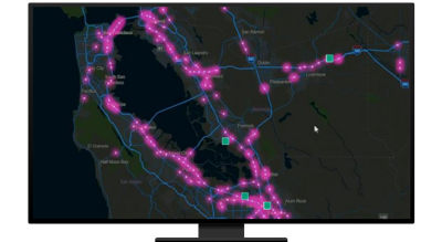 A graphic of a computer monitor displaying highway route points in purple on a black background