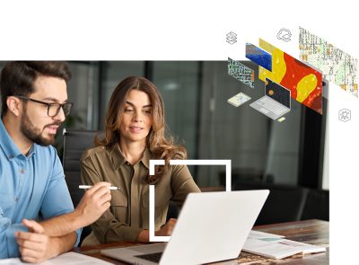 Nainen ja miest työskentelevät yhdessä, ja katsovat analytiikkaa kannettavalta tietokoneelta.