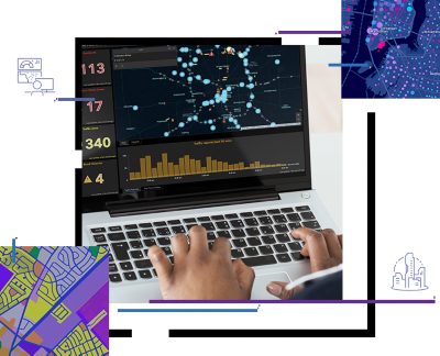 A person interacts with a laptop displaying complex data visualizations, including graphs, charts, and network diagrams.