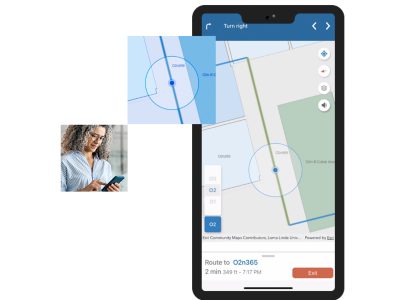 Téléphone mobile affichant une application de cartographie indoor d’un immeuble de bureaux, avec un itinéraire et des bureaux mis en évidence