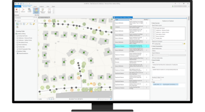 Desktop computer with mapping software being used to analyze a neighborhood