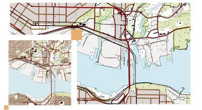 Street map of a city with a blue body of water and black, red, and brown lines 
