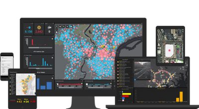 A collection of devices showcasing data visualization dashboards, including maps, charts, and analytics. 