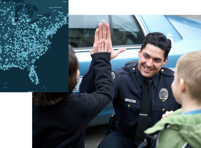 A police officer giving a child a high-five