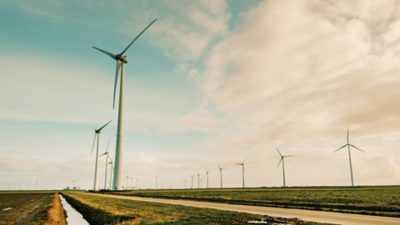 Image courtesy of Organic Valley shows an aerial view of pastureland, overlaid with colorful layers that quantify vegetation health, with the healthiest plants shown in green and plants experiencing stress and disease in red.