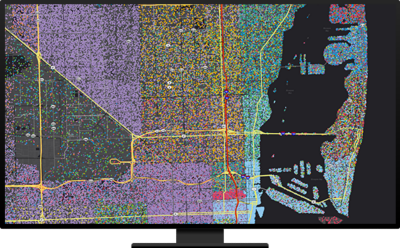 A vibrant digital map displayed on a widescreen monitor, showcasing intricate geographic details and colorful data points.