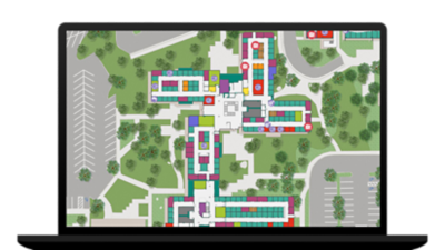 Laptop showing a digital image of a campus with squares, circles, and green trees representing a space management interface