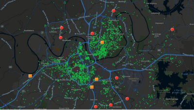 Dark gray map with blue lines and green dots