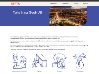 Lush green vineyard stretched over a hilly landscape under a cloud-filled sky