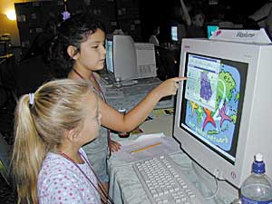2 young students learning about GIS