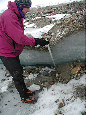 photo of Peter Haeussler taking a measurement.