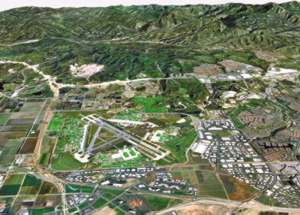 In ArcView 3D Analyst, the building inventory at El Toro is superimposed over aerial photography and a digital elevation model.