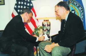 James Lee Witt and Jack Dangermond formalize Esri becoming a Business partner for Project Impact.