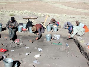 Indian workers help with excavations