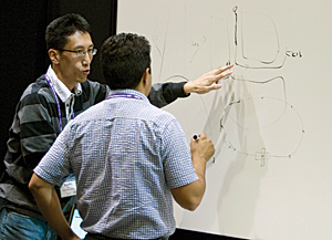 developers discussing code at the Esri Developer Summit 2007
