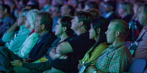 photo of audience listening to a user conference plenary session