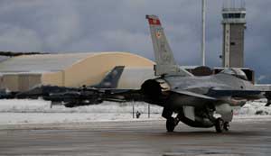 Two F-16 Fighting Falcons taxi down the runway prior to takeoff from Hill AFB.