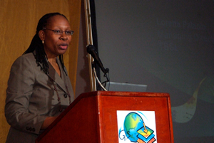 Loretta Garcia-Palacio welcomes attendees to the Belize GIS User Conference and Exhibition.