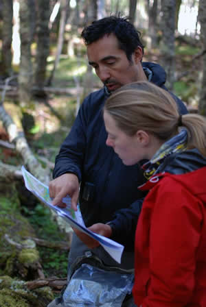 Patagonian Expedition Race director Stjepan Pavcic and cartographer Katie Panek examine the map of the proposed Karukinka trail.