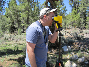 A forester learns to capture  measurements using laser technology.